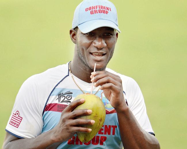 Windies skipper Darren Sammy sips coconut water during a practice session yesterday. Pic/AFP