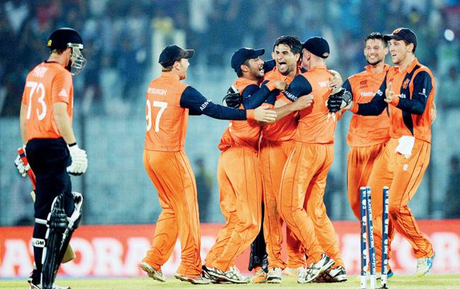 Holland players celebrate their win over England at the Zahur Ahmed Chowdhury Stadium in Chittagong yesterday. Pic/AFP