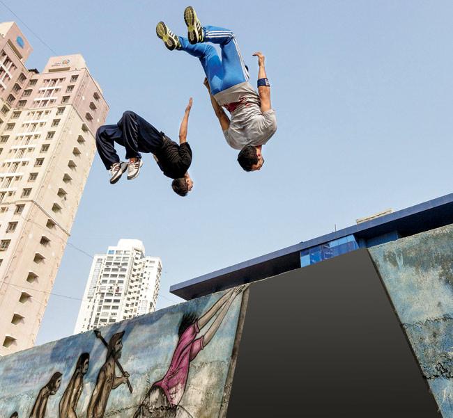 Mohammed Al Attar (right) and a participant doing flips