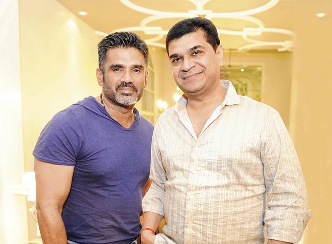 Actor Suniel Shetty and director Asshu Trikha at a designer store where Suniel had a styling session 