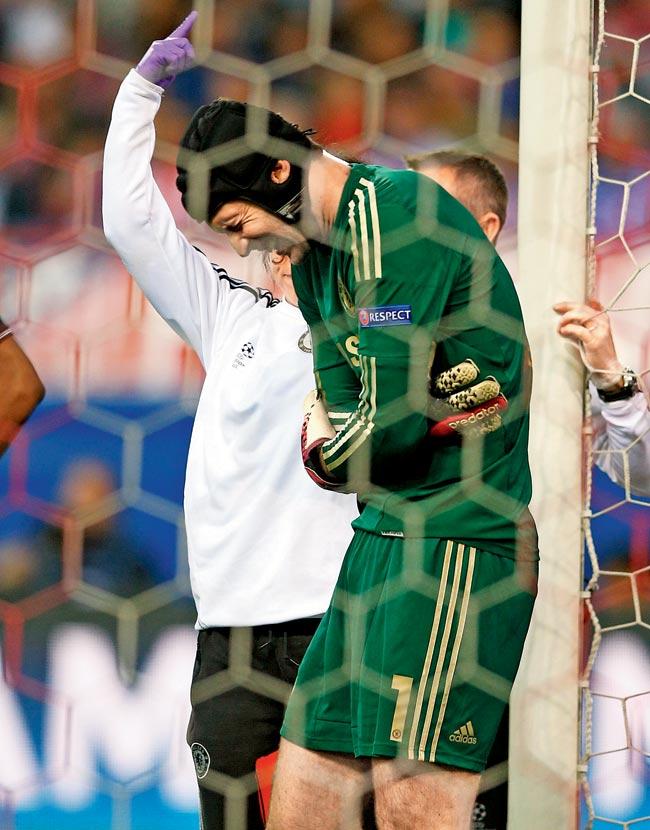 Petr Cech walks off the pitch after being injured at the Vicente Calderon Stadium on Tuesday. Pic/Getty Images