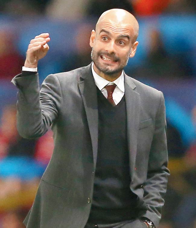 Bayern Munich coach Pep Guardiola gives instructions during the United match