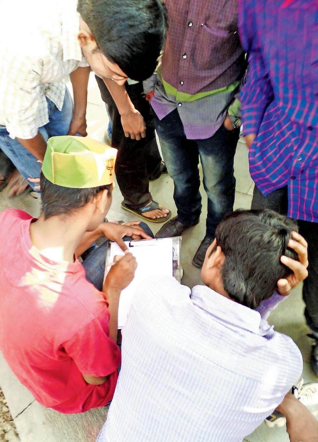 Vote bribe: An activist checks the name of students against the voters