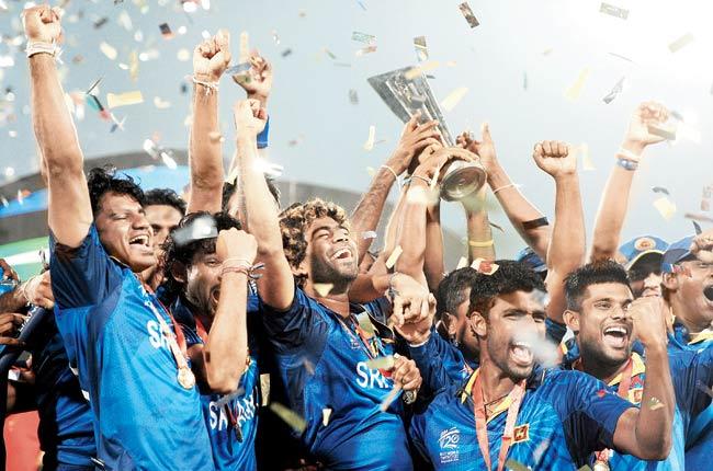 Sri Lanka captain Lasith Malinga lifts the ICC World Twenty20 trophy in Mirpur yesterday