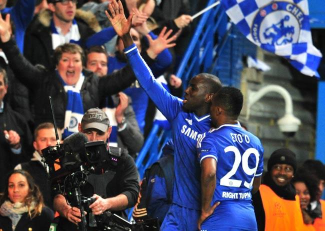 Chelsea-s French-born Senegalese striker Demba Ba L celebrates with Chelsea-s Cameroonian striker Samuel Eto-o R after scoring their second goal during the UEFA Champions League quarter final second leg football match between Chelsea and Paris Saint-Germain at Stamford Bridge in London. Pic/AFP