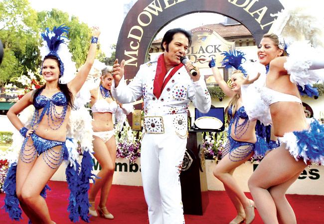 Men can sport dots too as this Elvis lookalike and the dancers at Mahalaxmi racecourse show