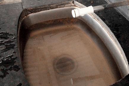 Blocked drains choke water taps at Pune station