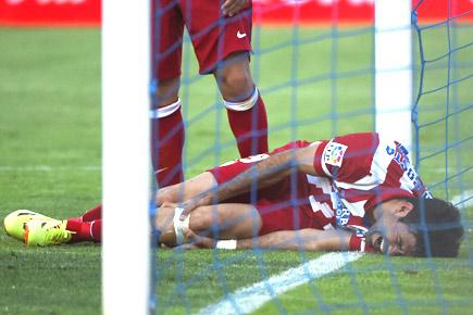 La Liga: Diego Costa hurt as Atletico Madrid maintain lead atop