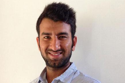KXIP's Cheteshwar Pujara takes time out from IPL 7 to cast vote