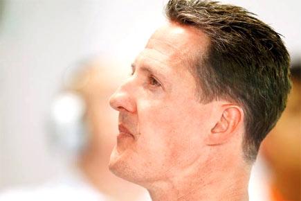 Michael Schumacher remains in 'waking up phase'