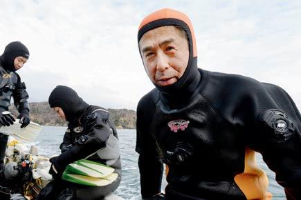 Man dives to find his wife who went missing in Japanese tsunami