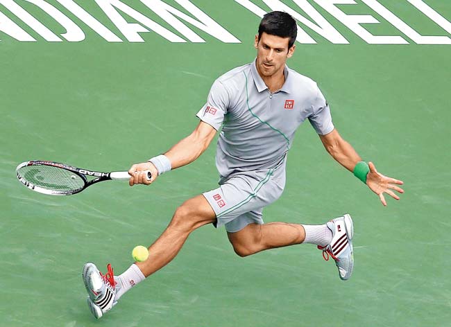 Novak Djokovic lunges to return a forehand to Alejandro Gonzalez of Colombia during their third round clash at Indian Wells. Pic/AFP