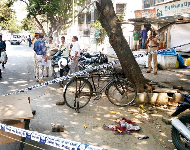 Bloody spot: The spot where Sandeep Dhag (below)was having a cup of tea before five men armed with choppers stabbed him to death