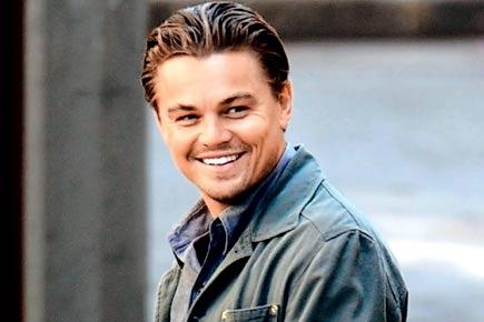 Leonardo DiCaprio spotted kissing another mystery woman