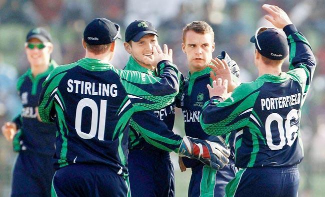 Ireland celebrate a Zimbabwe wicket during the ICC World Twenty20 Round One match in Sylhet yesterday. Pic/PTI