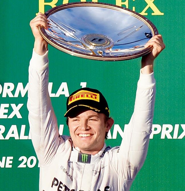 Nico Rosberg celebrates with his trophy atop the podium. Pics/afp