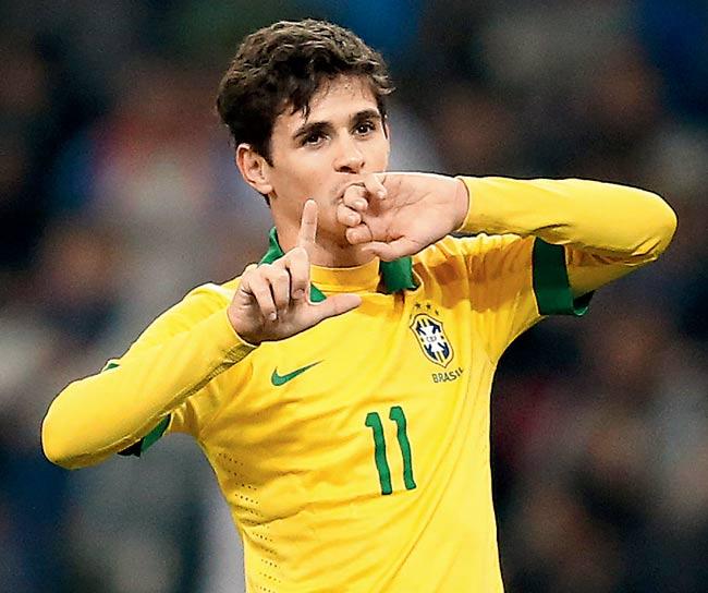 Oscar does his trademark L-shaped celebration after scoring for Brazil. Pic/Getty Images