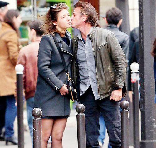 Sean Penn kissing French actress Adele Exarchopoulos after having lunch with her on March 22 in Paris, France