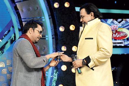 Mika Singh gifts Mithun Chakraborthy a branded watch