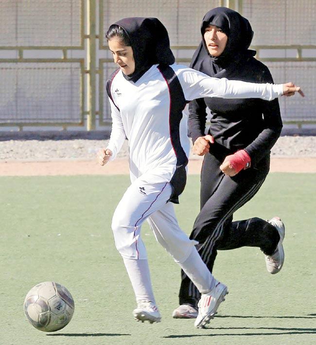 Iranian female footballers wear head scarves while training in Tehran last year. Pic/AFP