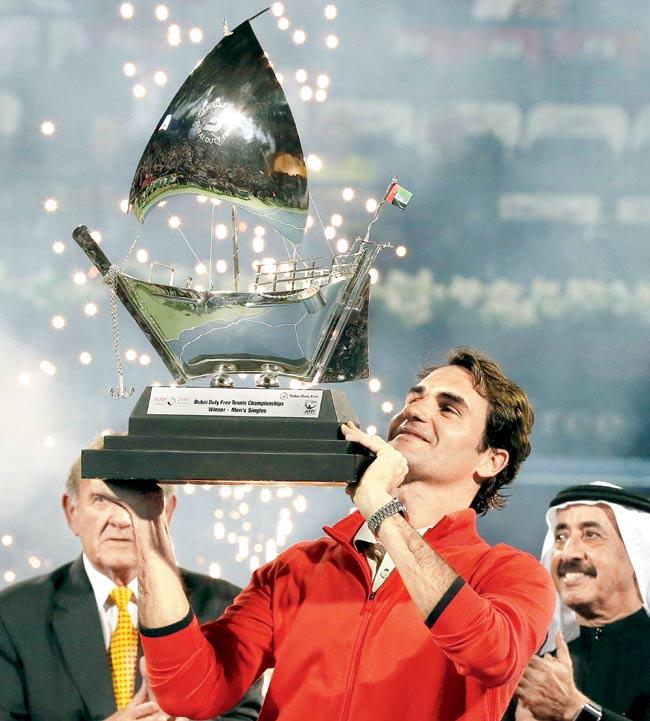 Roger Federer with the trophy. Pic/AFP