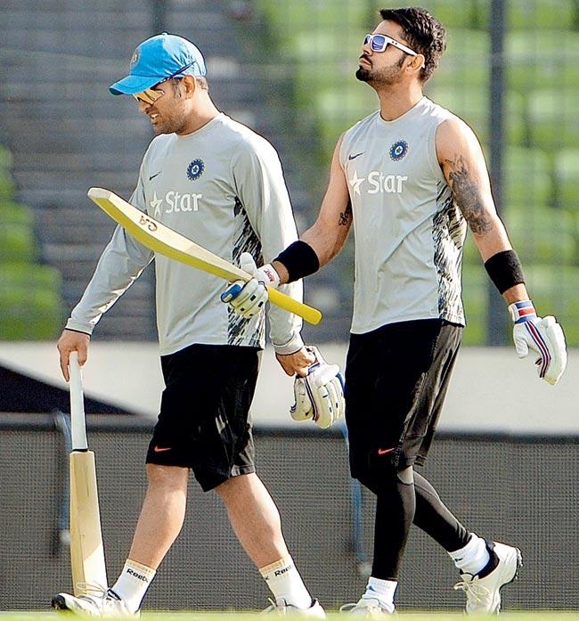 India captain MS Dhoni (left) with Virat Kohli during a practice session in Dhaka on Saturday. Pic/AFP