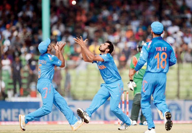 Mohammed Shami and Ambati Rayudu (left) go for a catch against Bangladesh in the Asia Cup in Fatullah. Pic/AFP