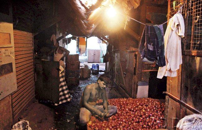 Lack of electricity means shopkeepers have to steal it to light up their shops. Pics/Nimesh Dave