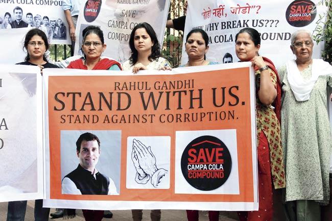 Residents of Campa Cola hold demonstration for the attention and support of Congress Vice President, Rahul Gandhi to save their homes, on the eve of his visit to Mumbai