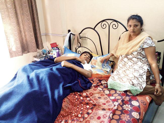 Dakshesh Mistry with mother Dimple; he cannot move due to the spinal injuries he suffered during the mishap 