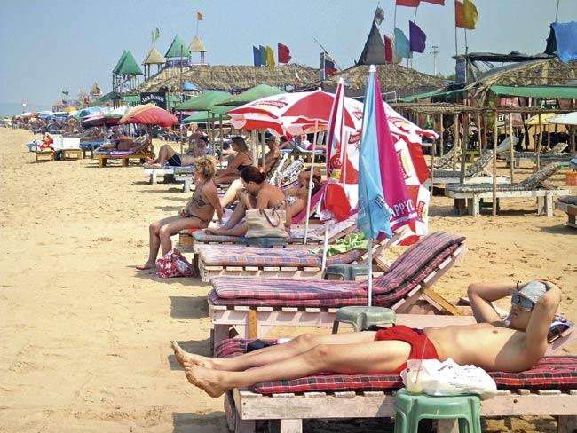 Russian charter tourists on the beach at Candolim