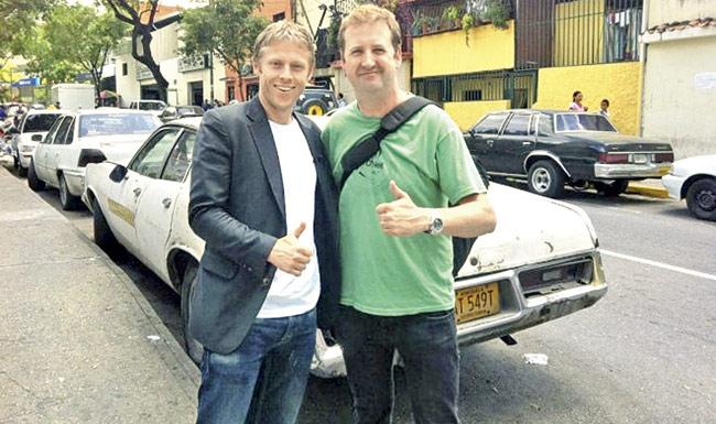 Gunnar Garfors (left) and Adrian Butterworth celebrate as they land in Caracas, Venezuela