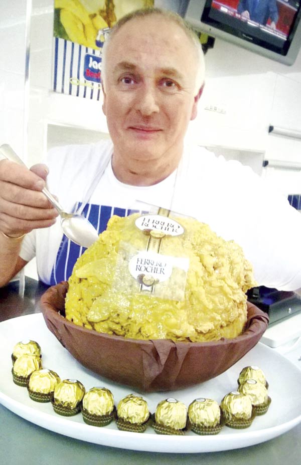 John Clarkson with his five-kg Ferrero Rocher treat, which contains more than 25,000 calories