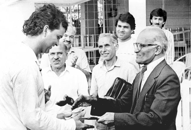 Shishir Hattangadi (left) receiving an award from then Mumbai Cricket Association president Madhav Mantri (right) at Wankhede Stadium in the course of the 1988-89 Ranji season. A clapping P K ‘Joe’ Kamath is to Hattangadi’s left. Pic/MiD DAY Archives