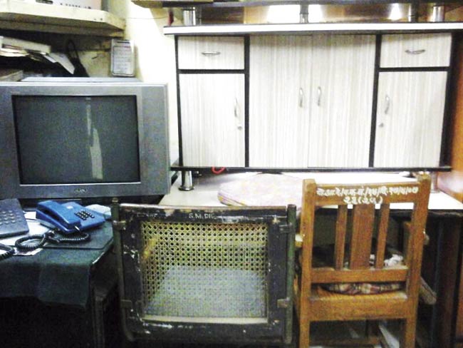 The table and TV set seized by the police from the accused