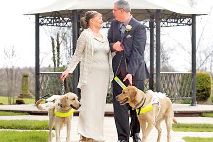 Blind couple weds after their guard dogs bring them together