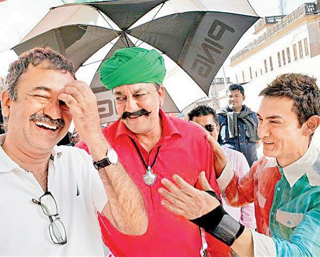 Rajkumar Hirani with Sanjay Dutt (centre) and Aamir Khan (right) on the sets of P.K.