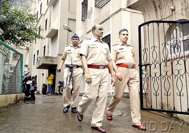 Police personnel exit from the L- 9 building of the police quarters in Prateeksha Nagar, Sion, where 29-year-old Police Sub-Inspector, Sandeep Pokhrankar killed himself yesterday. Pic/Shadab Khan