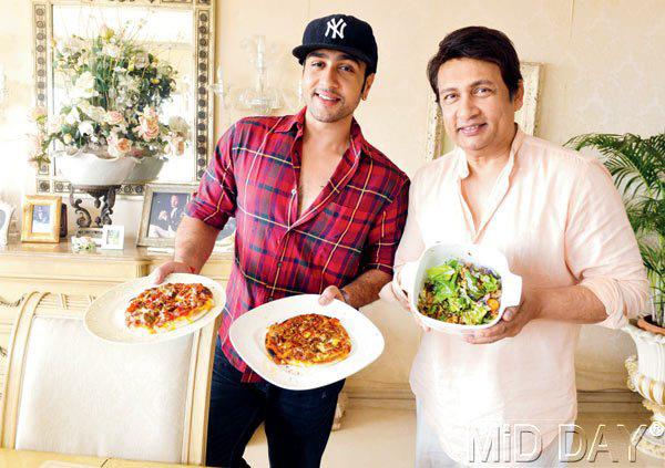 Adhyayan and Shekhar Suman with Mushroom and Paprika Pizza and Chicken Salad