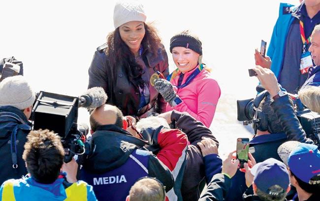 Serena Williams with Wozniacki moments after the New York Marathon on Sunday. Pic/AFP