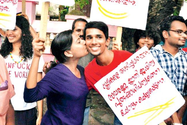 make love, not war: A girl kisses a boy as a sign of support to the ‘Kiss of Love’ protest rally, in Kochi on Sunday pic/PTI