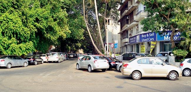 UNDER THE TREE: Marine Drive parking lot has numerous cases of double parking which annoys many car owners who park here. PICS FOR REPRESENTATIONAL PURPOSE ONLY