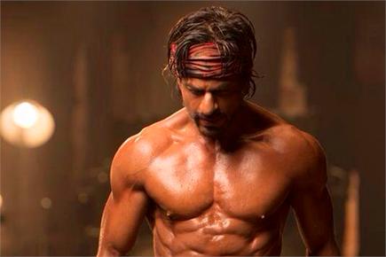 Shah Rukh Khan unveils eight-pack abs for 'Happy New Year'
