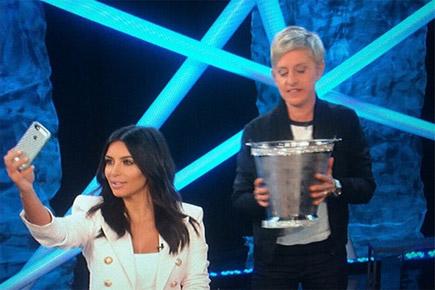 Kim Kardashian takes 'selfies' while completing ALS Ice Bucket Challenge