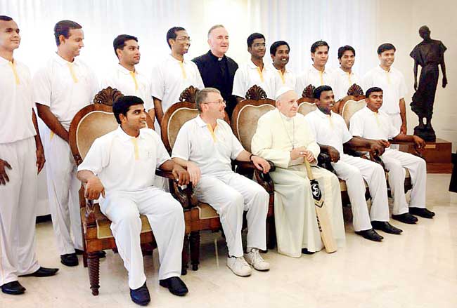 The Vatican cricket team with Pope Francis (centre). Pic/Vatican Radio