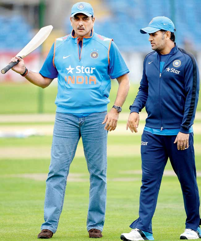 Ravi Shastri talks with India skipper MS Dhoni during a practice session at Headingley last week. Pic/Getty Images