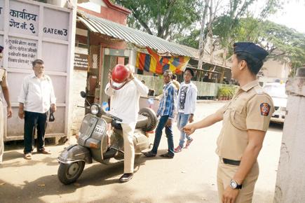 Traffic dept turns blind eye to cops without helmets