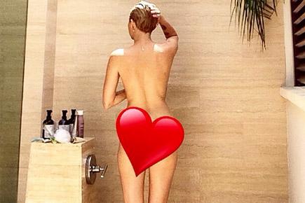 Miley Cyrus posts a nude picture of her in a shower