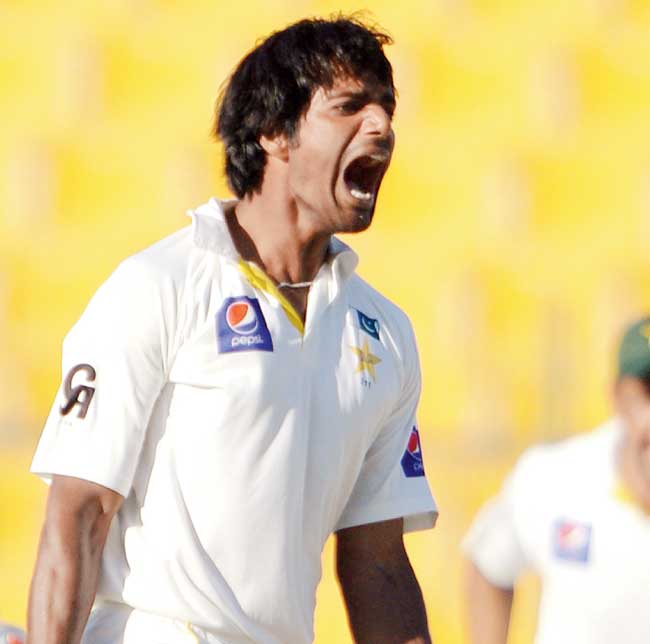 Rahat Ali celebrates a Kiwi wicket in Abu Dhabi yesterday. He finished with 4-22. Pic/AFP