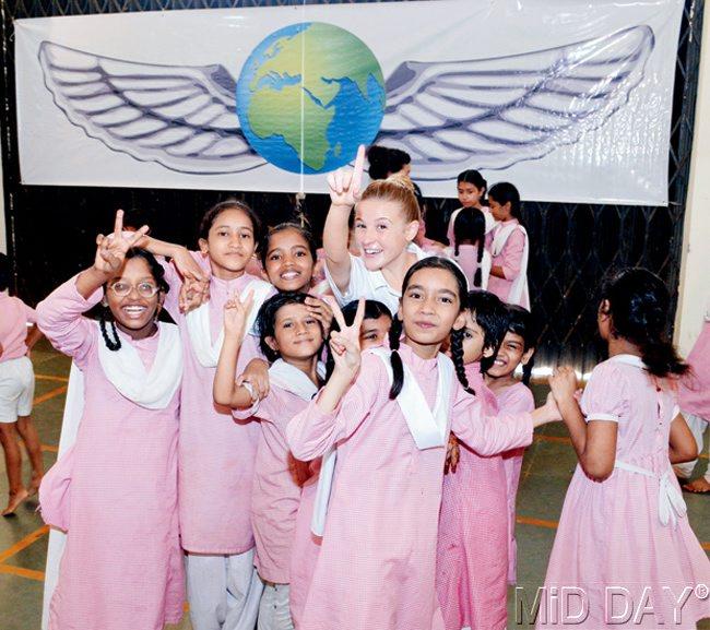 FLYING HIGH: Sivan Keller with some of the Urdu medium students of Santacruz Municipal School. 